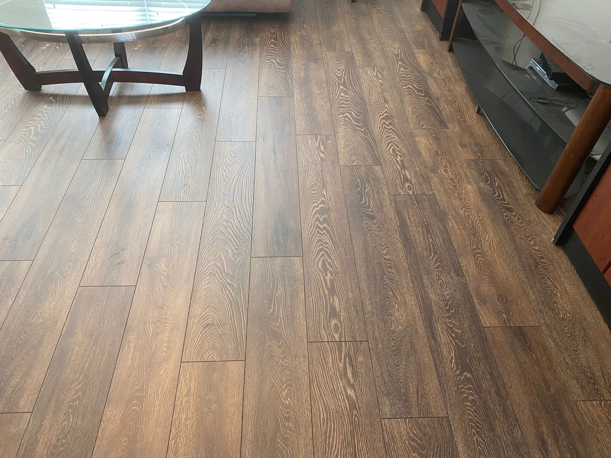 Dark engineered hardwood floor in a finished living space